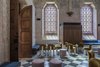 Modern home with Living Room, Chair, Table, Stools, and Bench. Gorgeous golden-yellow Cini Boeri Botolo chairs pair perfectly with the chapel's neutral palette and high ceilings. Photo 13 of Jaffa Hotel
