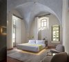 Modern home with Chair, Rug Floor, and Wall Lighting. The rooms boast the same contemporary yet historic feel. This is the Jaffa Room. Photo 16 of Jaffa Hotel