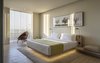 Modern home with Wall Lighting, Chair, Rug Floor, and Bench. The bedroom of the Presidential suite. Photo 18 of Jaffa Hotel