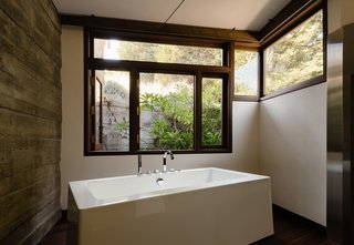 A light-filled bath with a deep soaking tub.