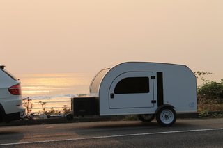 At only 950 pounds, the DROPLET can be towed by most small cars. Measuring at only 6.6 feet wide, 13.5 feet long, and 5.5 feet high, it can also easily be parked in a garage. 