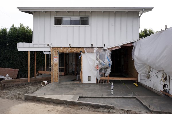 This image shows the foundation at the side yard which would pave way for a new asymmetrical entry.