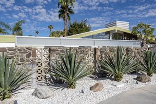 The high gable roofline is a hallmark of midcentury modern architecture.