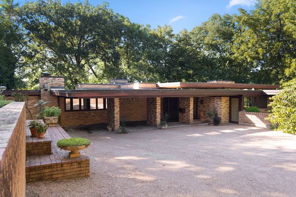 The L-shaped home is a classic example of Frank Lloyd Wright's Usonian style. 