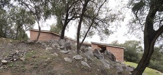 The side view shows an outcropping of rocks. 