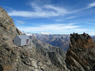 A small niche at the entrance helps protect the door from wind and snow and provides a small storage space for gear.