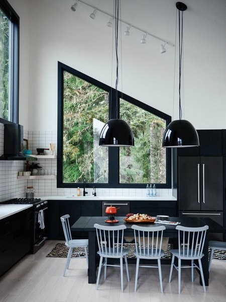 The dining area's Salt Chairs are from DWR. The Factory Light 9 Pendant is from Schoolhouse. 