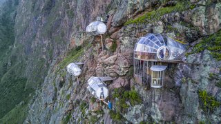 Handcrafted from aerospace-grade aluminum and weather-resistant polycarbonate, the capsules offer guests a 300-degree view of Peru's Sacred Valley. 