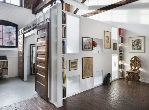 Translucent walls section this bedroom off from the living space while allowing light to enter other areas of the home.