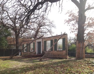 Before: following the demolition of the original home, only the front facade remained.
