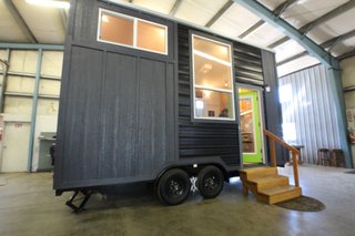 Tiny Mountain Houses builds their tiny homes with three goals in mind: craftsmanship, comfort, and affordability. Their customizable models feature hand-selected wood and are available in both single-level and lofted floor plans. This model, the Little Tahoma Peak 18', starts at $46,750. Tiny Mountain Houses offices in Salem, Oregon, and Roseville, California.