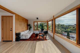 The downstairs features a den, wet bar, two additional bedrooms, and a full bath.