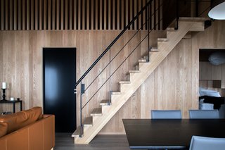 Above the living space, stairs lead to an open attic that provides enough space for eight people to sleep.