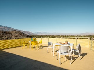 The contractor spent days restoring the yellow corrugated fiberglass panels that wrap around the deck—one of the home's avant-garde 1950s features.