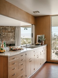 The kitchen looks out on desert views. 