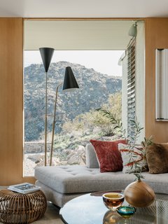 Large, full-height windows bring a sense of the surroundings inside the home. 