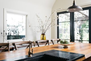 The walnut island houses the sink. 