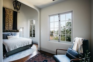 This bedroom is tucked in the turret of the Tudor-style home.