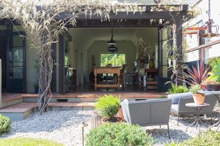 The kitchen fully opens to the backyard. 