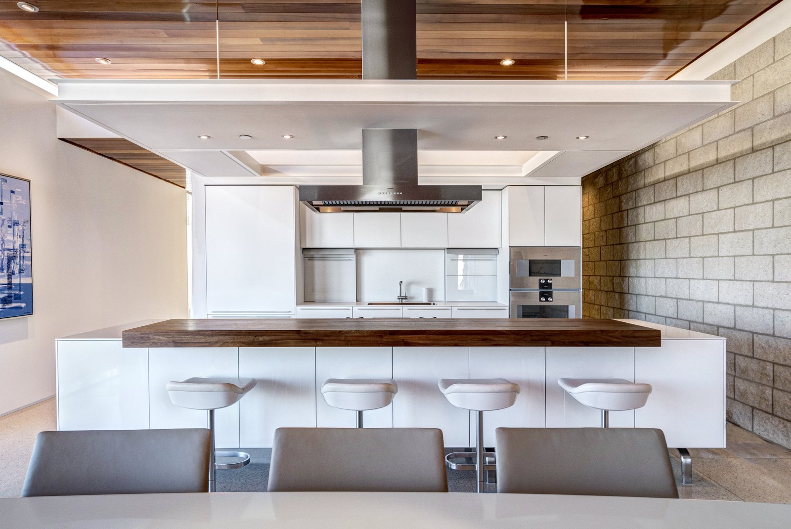 The custom Bulthaup kitchen is outfitted with Gaggenau appliances and Caesarstone countertops. 