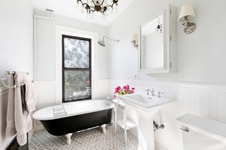 The bright, updated bathroom comes with a clawfoot tub.