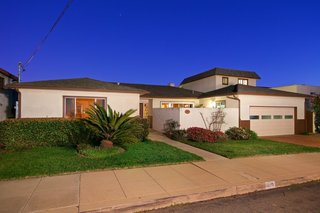 The exterior of the 1960s home as it appeared prior to the renovations. 