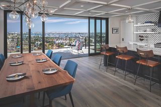 Fotsch reframed the upper-level floor system to maximize the height of the doors and take them all the way to the ceiling. The expansive multi-slide doors from Kolbe provide a seamless transition to the outdoors and an uninterrupted view. 