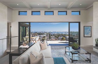 The extra 14-inch ceiling height brings light and harbor views into the space, while transom windows add a bonus sky view.