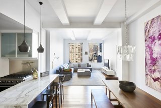 The open-plan layout is bright and airy thanks to high ceilings and oversized windows.