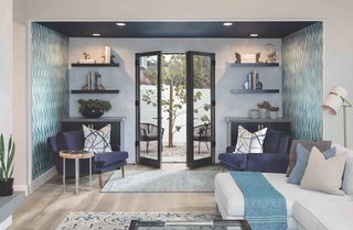 The former dining room was converted into a sitting nook just off the living room, which the family now affectionately refers to as the "parlor." Kolbe french doors provide outdoor access.