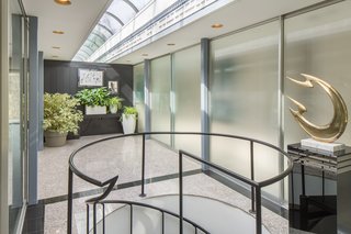 The 20-foot-long domed atrium is flooded with natural light. 