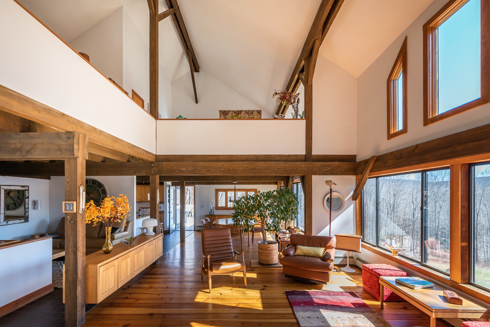 The living area features vaulted ceilings and a lofted second floor.