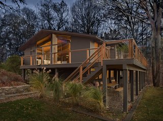 The home glows from within at dusk.