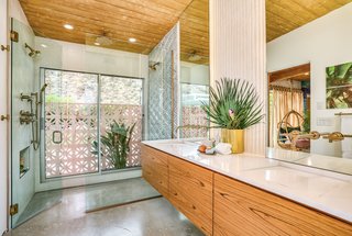 The second master bath has a glass-enclosed shower. 