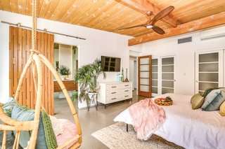 This is the original master bedroom. The teak barn door is similar to the one in the new master bedroom. 