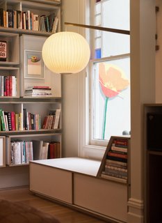 The custom-made reading nook. A Fnnch poppy mural is located on the outside wall.