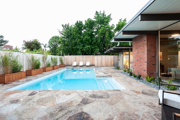 The backyard has been given over to a pool which is perfect for indoor-outdoor entertaining.