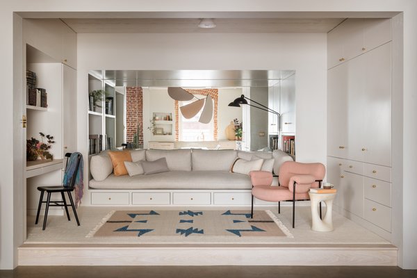 The Cozy Room is a more intimate space for reading, drafting letters ("an activity our client has turned into a true art form," notes Eng-Goetz), and watching movies. JHID lowered the ceiling height and raised the floor by a single step in order to give the room a different scale compared to the rest of the apartment. "When you're in the Cozy Room, you feel hugged by the interior architecture, while still being connected to the public spaces that it so clearly looks out on," says Eng-Goetz.