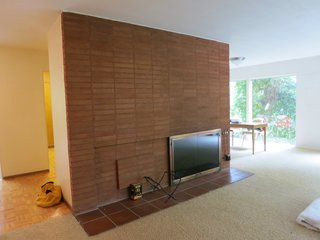 This was the original fireplace with brick that went up to meet the dropped ceiling. The original living room was large but had low ceilings and the proportions were off. 