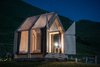 Modern home with Exterior, Wood Siding Material, Tiny Home Building Type, Gable RoofLine, and Cabin Building Type. The door panels open fully to the surroundings. Photo 7 of Immerso Glamping Cabin