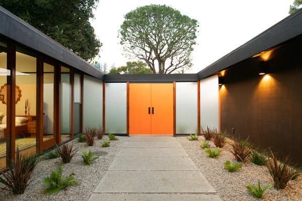 After entering, the home starts to unfold. The actual entrance is really an interior garden, a design element that definitely sets the tone for indoor-outdoor living. 