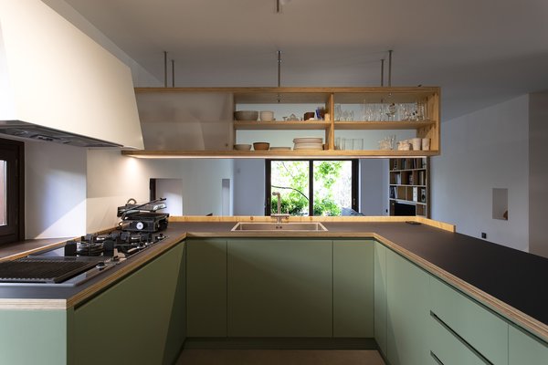 The kitchen cabinetry and countertops are fashioned out of pine plywood. The countertops also sport a layer of black bakelite, a type of plastic, for added strength and functionality. "This was an inexpensive but practical and stylish solution," says Exarchou.  