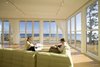 Modern home with Living Room, Sofa, Sectional, Pendant Lighting, and Light Hardwood Floor. Folding glass NanaWall system in living room overlooking Atlantic Ocean Photo 3 of Mulberry Point House