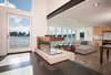 Modern home with Doors, Metal, Exterior, Folding Door Type, and Wood. Two-sided gas burning fireplace, opening glass NanaWall WA67 system, polished concrete floor, exposed structural beam, recessed lighting, views of Seattle and Lake Union Photo 9 of Houseboat H