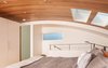 Modern home with Bedroom, Light Hardwood Floor, Bed, and Recessed Lighting. Ceiling finished with wood from the original, 100-year old houseboat float that burned down Photo 16 of Houseboat H