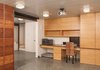 Modern home with Office, Chair, Desk, and Concrete Floor. Home office with built-in storage, under desk dog bed, exposed structural beam, Epic decking ceiling, polished concrete floors in the full-height concrete float Photo 3 of Houseboat H