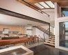 Modern home with Living Room, Concrete Floor, Gas Burning Fireplace, Recessed Lighting, and Two-Sided Fireplace. Living room with two-sided gas burning fireplace, bamboo stair tread, exposed structural beam, and ceiling finished with wood salvaged from the original 100-year old houseboat float Photo 6 of Houseboat H