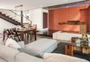 Modern home with Living Room, Gas Burning Fireplace, Coffee Tables, Recessed Lighting, Pendant Lighting, Sofa, Two-Sided Fireplace, and Concrete Floor. Exposed red siding, couch, living area, cable railing, and salvaged wood coffee table Photo 12 of Houseboat H