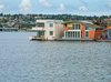 Modern home with Exterior, Metal Siding Material, Concrete Siding Material, House Building Type, Curved RoofLine, Vinyl Siding Material, Boathouse Building Type, and Metal Roof Material. Exterior shot of Houseboat H Photo 4 of Houseboat H