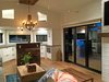 Modern home with Doors, Wood, Exterior, and Folding Door Type. Living room, opening glass NanaWall system, chef's kitchen Photo 19 of Iki Hau'oli Hale (Tiny Happy Home)